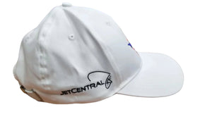 White cap with 'JETCENTRAL' logo on a wooden surface